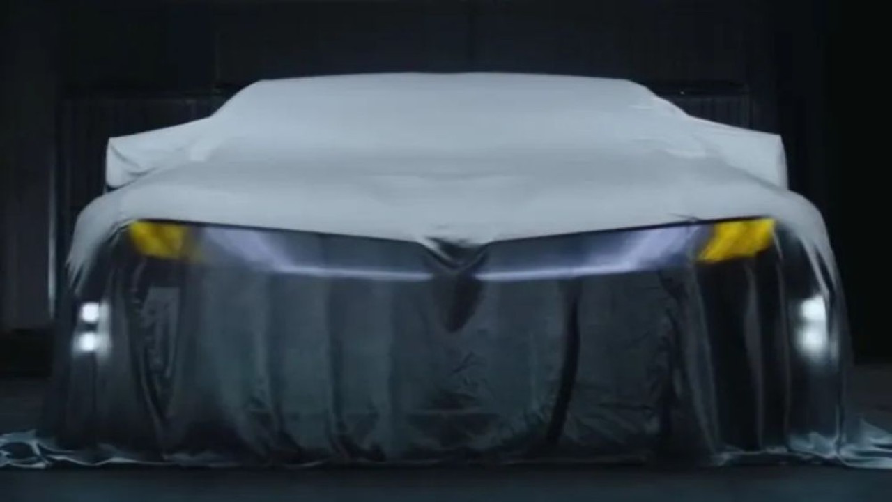 Gambar yang bocor di media online menunjukkan sosok sedan listrik yang diyakini sebagai calon BMW iM3. (Foto: Istimewa via Carscoops)